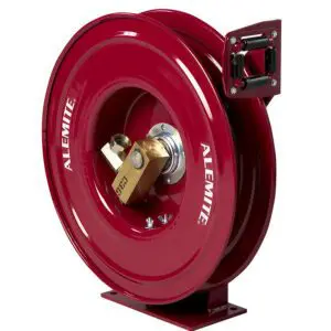 A red hose reel with the handle on it.