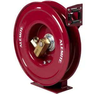 A red hose reel with the handle on it.