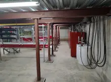 A room with many pipes and some red boxes