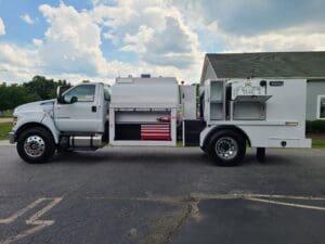 A white truck parked in the parking lot.