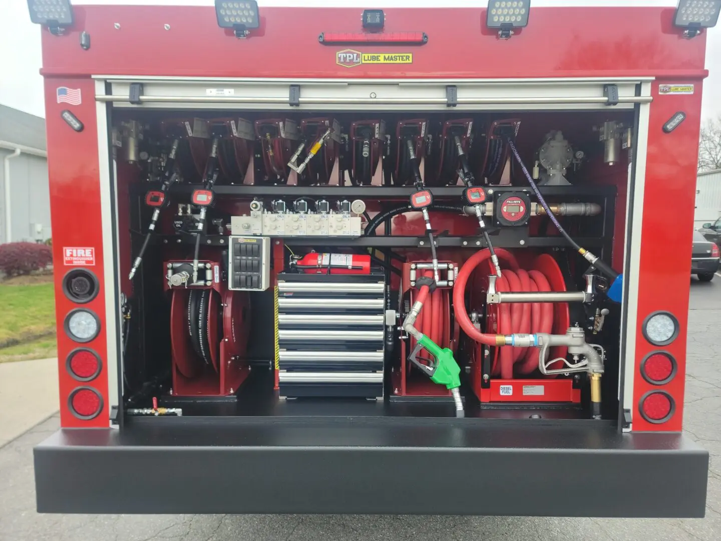 A fire truck with many compartments and tools.