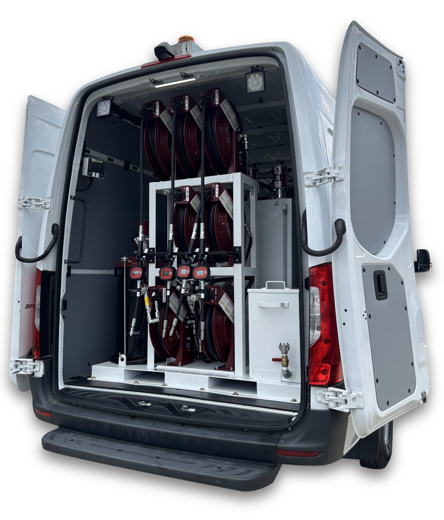 Rear of small white transport van with double doors open exposing white lube skid and red hose reels inside.