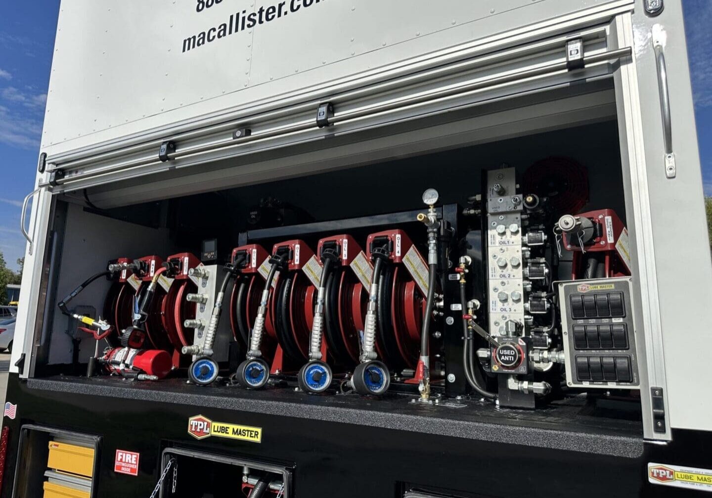 Open computer case showing several GPUs installed for mining or computation.