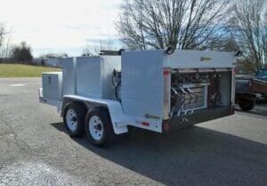 A white trailer with an open door on the side.
