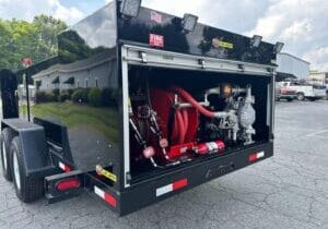Rear view of a Taylor Pump & Lift lube truck showing oil transfer pumps, hose reels, and a field-ready lube trailer system.